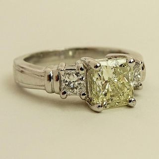 Diamond and Platinum Three Stone Engagement Ring, set in the center with an Approx. 2.01 Radiant Cut Diamond and flanked by two Radiant Cut Diamonds .