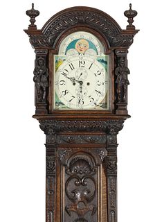 A HIGHLY CARVED OAK LONG CASE CLOCK WITH FIGURES C 1900