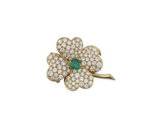 A French Van Cleef & Arpels emerald and diamond Cosmos brooch