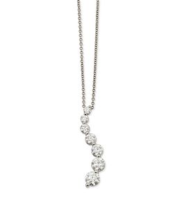A diamond wave pendant necklace