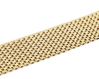 A gold wide bracelet