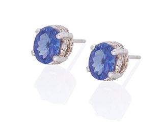 A pair of tanzanite and diamond stud earrings