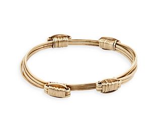 A gold elephant hair bangle bracelet