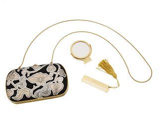 A Judith Leiber purse with accessories