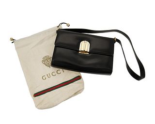 A vintage black leather Gucci handbag