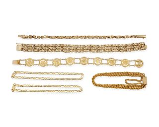 A group of six gold bracelets