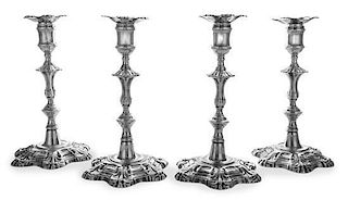 A Set of Four George II Silver Candlesticks, John Cafe, London, 1752, each having a candle cup surmounting a foliate and knopped