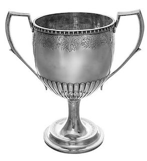 A George III Brittania Silver Trophy, Charles Marsh, Dublin, 1819, the body engraved with a floral and foliate band above a lobe