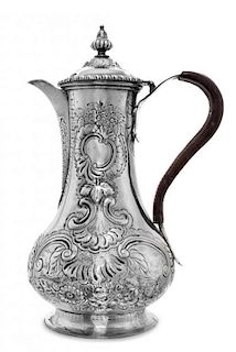 A George III Silver Coffee Pot, Louis Herne & Fras. Butty, London, 1762, of baluster form with a leather bound handle and spread