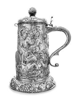 A German Silver Tankard, Hanau Marks, 19th Century, topped with a pomegranate finial, the body worked to show a medieval battle