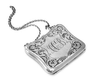 * A German Silver Purse, 19th/20th Century, of shaped rectangular form, worked to show floral and foliate decoration and centere