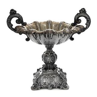 A Continental Silver Compote, , having foliate worked scroll handles, raised on a repousse worked base worked to show floral spr