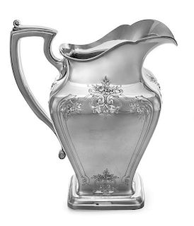 An American Silver Water Pitcher, Reed & Barton, Taunton, MA, the body of square tapering form, worked to show floral sprays and