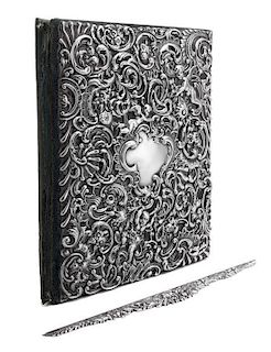 An American Silver Repousse Portfolio, Dominick & Haff, New York, NY, the portfolio cover decorated with rocaille, floral, folia