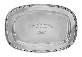 An American Silver Presentation Tray, Reed & Barton, Taunton, MA, of rectangular form with bowed sides, having a foliate and bra