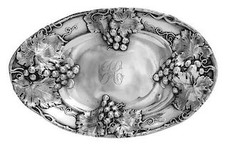 An American Silver Bowl, Mauser Mfg. Co., New York, NY, of oval form, the rim worked to show grape cluster and vine decoration,