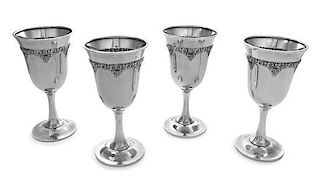 A Set of Four American Silver Water Goblets, R. Wallace & Sons Mfg. Co., Wallingford, CT, each having a floral and foliate decor