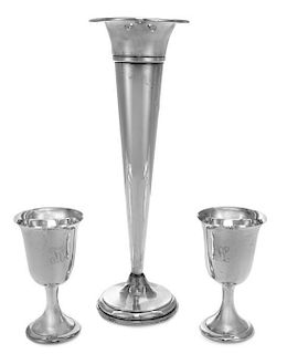 An American Silver Trumpet Vase, Various Makers, of elongated tapering form and raised on a circular weighted foot, together wit
