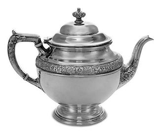 An American Silver Teapot, Alvin Mfg. Co., Providence, RI, having a horizontal band of floral decoration, raised on a stepped ci