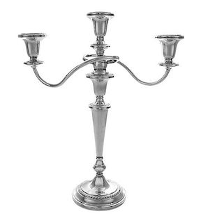 An American Silver Three-Light Candelabra, , having gardooned borders, the candle cups supported by serpentine arms issuing from