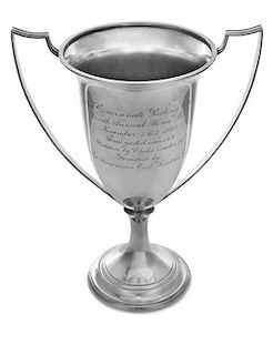 An American Silver Trophy, Chicago Silver Co., Chicago, IL, having two handles and raised on a trumpet form base, the body engra