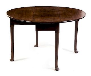 An English Oak Double Drop-Leaf Table Height 28 x width 16 1/2 x depth 48 inches.