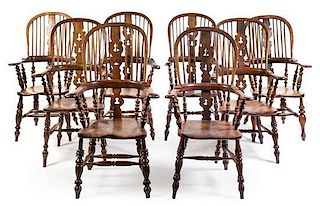 A Set of Eight Yew Wood Windsor Armchairs Height 46 inches.