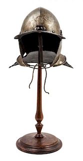 * A Cromwellian Lobster Tail Helmet Height 24 3/4 inches.