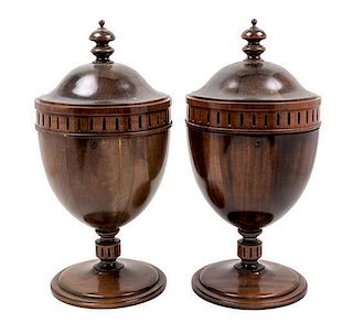 * A Pair of George III Style Mahogany Cutlery Urns Height 22 inches.