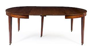 A Hepplewhite Mahogany Dining Table Height 30 1/2 x diameter 54 inches.