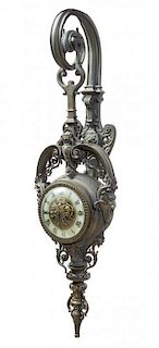 * A Victorian Metal Wall Clock Height 28 inches