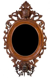 * A Victorian Carved Walnut Mirror Height 34 1/2 x width 21 1/2 inches.