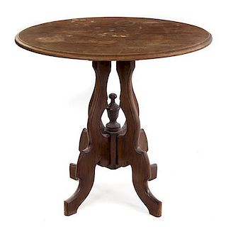 A Victorian Walnut Center Table Height 27 1/2 x width 31 x depth 24 inches.