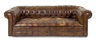 A Leather Upholstered Chesterfield Sofa Height 25 1/2 x width 81 1/2 x depth 36 1/2 inches.