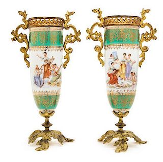 A Pair of Coalport Gilt Metal Mounted Porcelain Urns Height 11 3/4 inches.