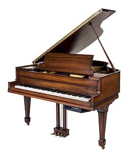A Baldwin Baby Grand Player Piano Length 61 1/2 inches.