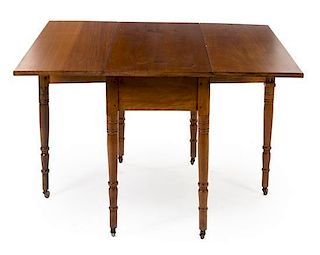 * An American Maple Drop Leaf Table Height 28 1/2 x width 44 1/2 x depth 18 inches (closed).