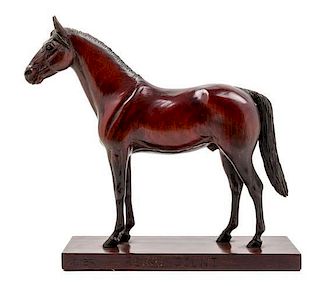 * A Carved Wood Figure of a Thoroughbred Horse Height 11 1/2 inches.