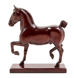 * A Carved Wood Figure of a Horse Height 10 1/2 inches.