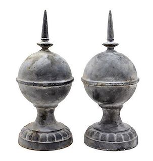 A Pair of Cast Metal Ornaments Height 20 inches.