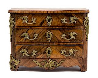 A Diminutive Regence Style Gilt Bronze Mounted Kingwood Commode Height 12 x width 16 x depth 9 1/4 inches.