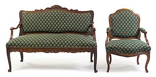 A Louis XV Style Oak Settee and Fauteuil Height 38 1/2 x width 53 x depth 23 inches.