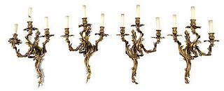* A Group of Four Louis XV Style Gilt Bronze Three-Light Wall Sconces Height 24 inches.