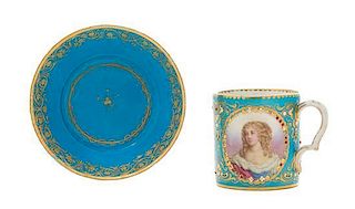 A Sevres Jeweled Porcelain Cup Height of cup 2 7/8 inches, diameter of saucer 5 1/8 inches.