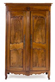 A Louis XV Provincial Walnut Armoire Height 85 1/2 x width 55 x depth 24 inches.