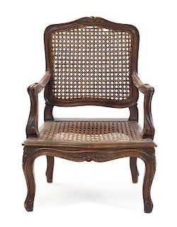 A Louis XV Style Provincial Child's Fauteuil Height 23 1/4 inches.