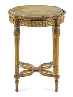 * A Louis XVI Style Giltwood Gueridon Height 29 1/2 x depth 24 inches.