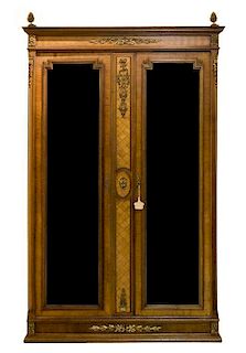 A Louis XVI Style Gilt Bronze Mounted Parquetry Decorated Armoire Height 87 x width 56 x depth 21 1/2 inches.