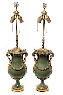 * A Pair of French Gilt Bronze Mounted Porcelain Urns Height overall 33 inches.