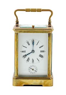 * A French Gilt Bronze Carriage Clock Height 5 3/4 inches.